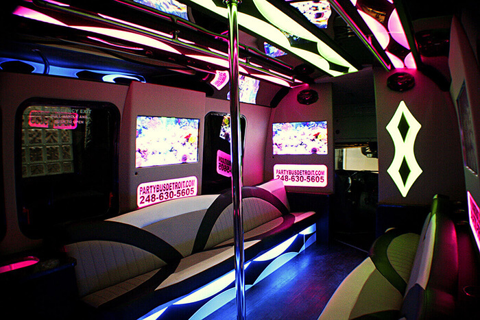 Hardwood dance floor and stripper poles on limo buses
